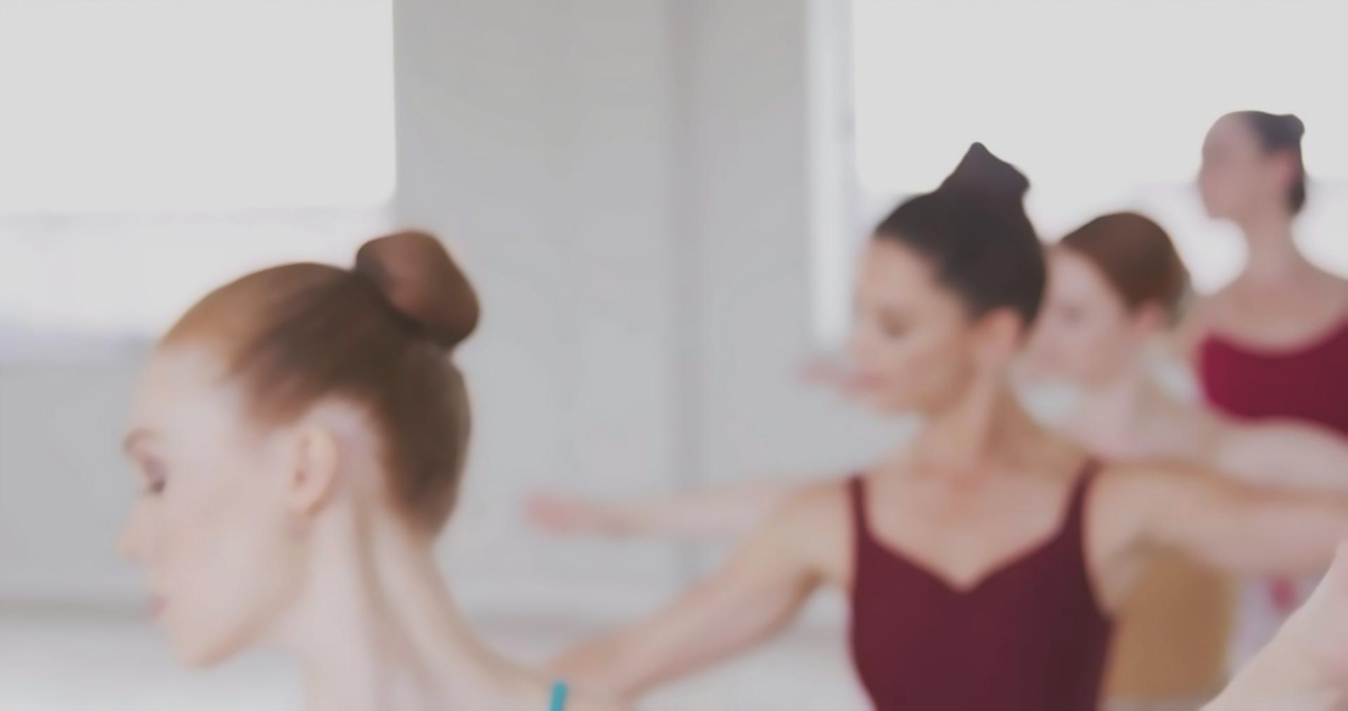 Dance instructor demonstrating jazz technique during practice session