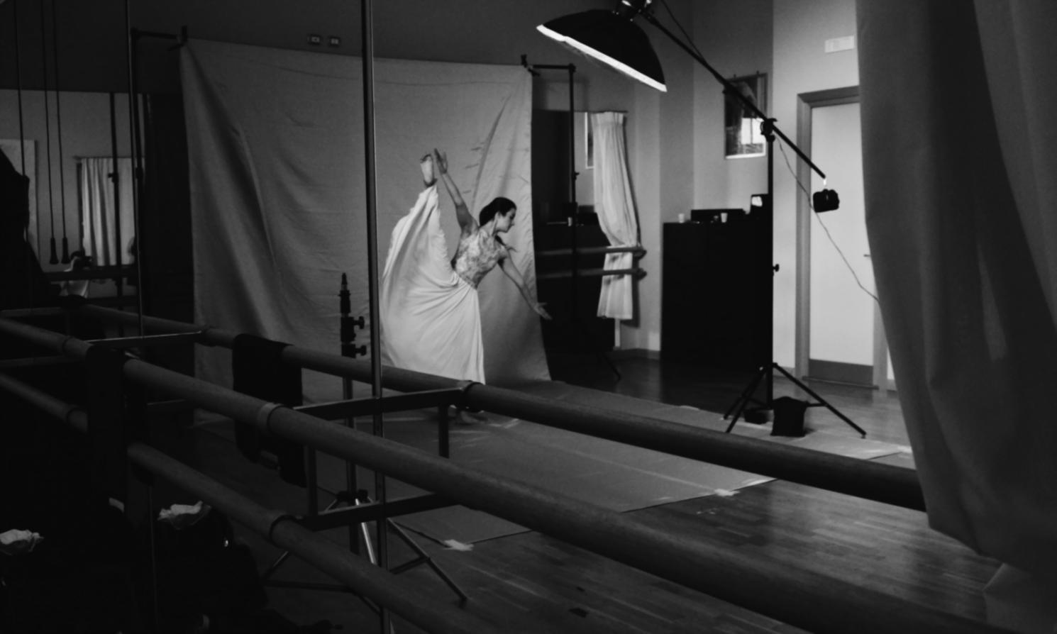 Students practicing jazz dance combinations in studio environment